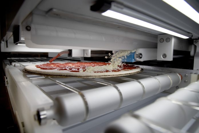 This New Robotic pizza-making machine can churn out 300 pies an hour- Details inside